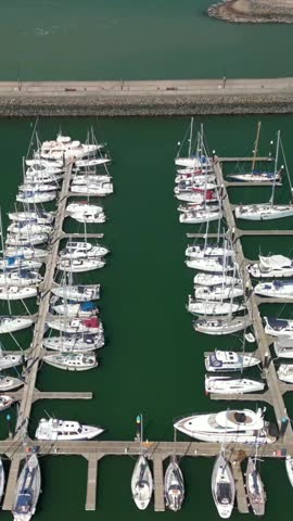 Reversing social ratio aerial video of Bangor Marina in Bangor, County Down in Northern Ireland. Filmed in 1080x1920 and with Rec709 color.