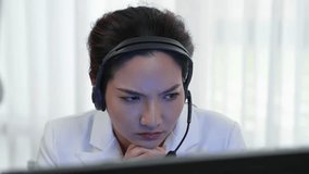 Businesswoman wearing headset working in office to support remote customer or colleague. Frustrated and tired call center customer support agent facing problem on providing vivancy service - Powered by Shutterstock - Get 15% off with code: PIKWIZARD15