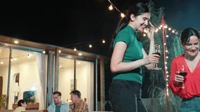 Family celebrate holiday. Mother and grandmother drink wine, cook food while father, grandfather and girl have dinner party food. Outdoor activity spend time together cross generation gap. Divergence. - Powered by Shutterstock - Get 15% off with code: PIKWIZARD15