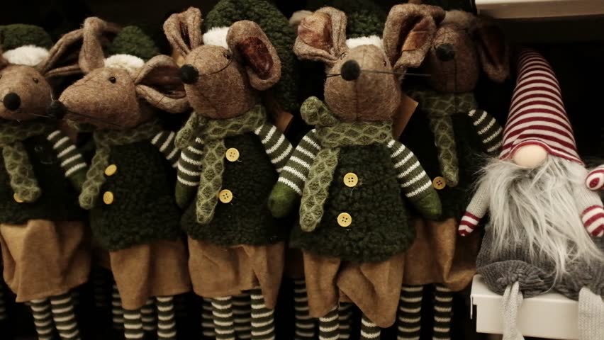 Soft cosy cute traditional Christmas plush mice toys. Winter holidays decoration and toys for kids. Xmas spirit gifts, holidays items, store shelves merchandise. Getting ready for Christmas.