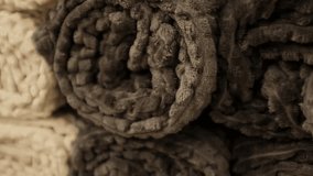 Rolled fluffy cozy and soft plush blankets. Modern aesthetic comfortable living room or bedroom home decor. Snuggly bedding covers. Store shelves merchandise display. - Powered by Shutterstock - Get 15% off with code: PIKWIZARD15