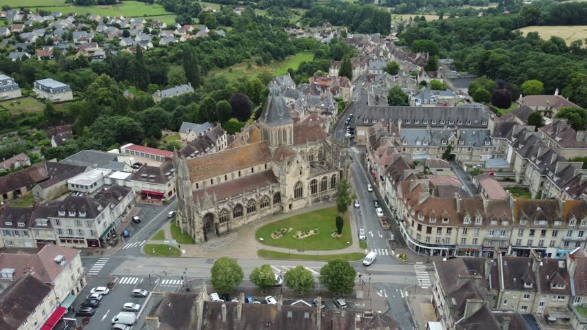Cityview of Falaise under cloudy skies on a warm summer day