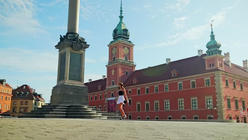 Slow motion cinematic shot near Royal Castle Warsaw with Sigismund Column