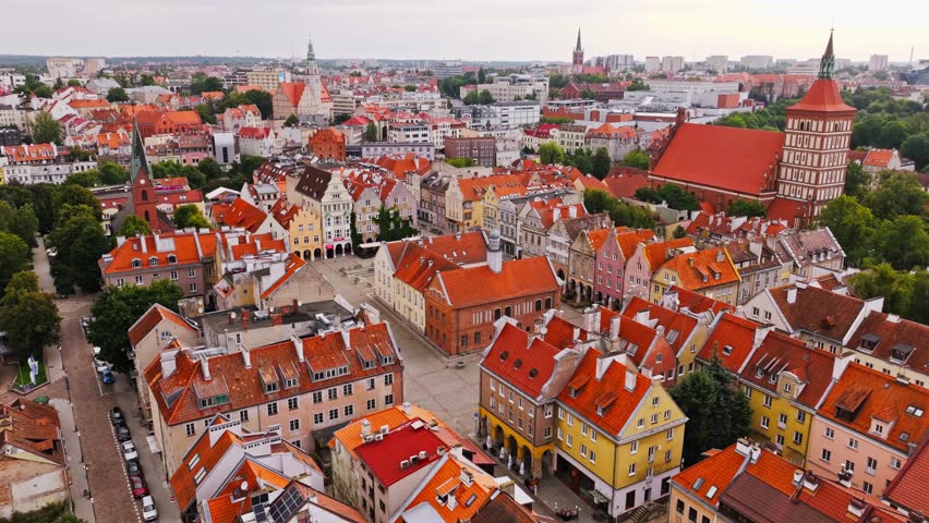 Drone orbiting and ascending to reveal panoramic view of Olsztyn Old Town