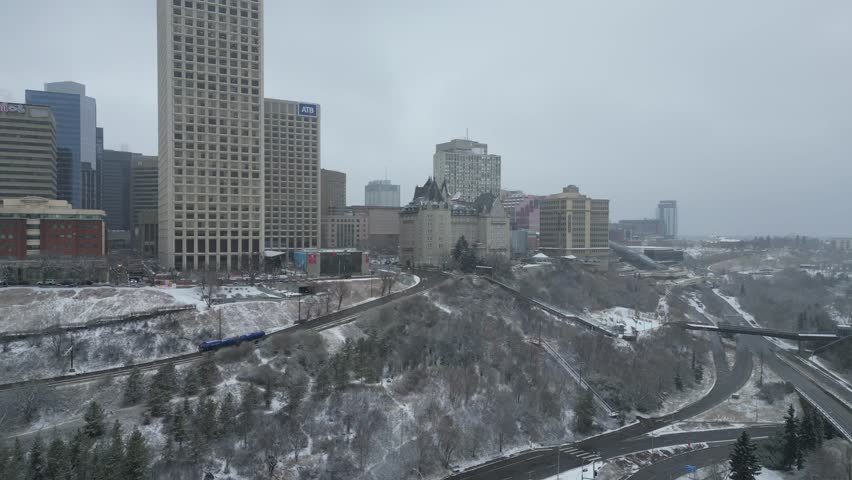 Edmonton in Snow, hotel macdonald, edmonton river valley, river boat, cn tower and downtown skyline drone aerial