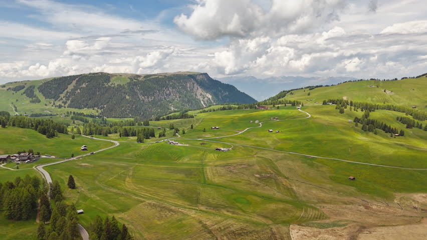 Alpe di Siusi meadows with pasture parcels, aerial view. Summer alpine plateau in South Tyrol, Italy