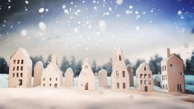 Miniature houses in a snowy winter village scene. Cozy decorative Christmas town with snow covered rooftops, falling snowflakes in endless seamless loop. - Powered by Shutterstock - Get 15% off with code: PIKWIZARD15