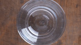 Glass being filled with carbonated soft drink, you can see the fresh bubbles of the beverage. Brown soda from the plastic bottle pouring to a glass, close up, top view  - Powered by Shutterstock - Get 15% off with code: PIKWIZARD15