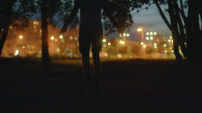 This video showcases a lively night park with activities. A man runs determinedly, another jumps rope showcasing agility, while a couple shares a romantic moment under the stars - Powered by Shutterstock - Get 15% off with code: PIKWIZARD15