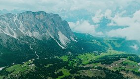 Val Gardena valley Seceda mountain, aerial view. Overcast sky and fog on Dolomite scene - Powered by Shutterstock - Get 15% off with code: PIKWIZARD15