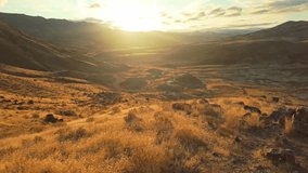 Panoramic view of the Painted Hills, showcasing their vibrant layers of red, gold, and black as seen from the elevated Carroll Rim Trail viewpoint at the John Day Fossil Beds National Monument - Powered by Shutterstock - Get 15% off with code: PIKWIZARD15