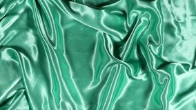 Elegant shiny luxury satin green fabric or curtain - closeup shot - Powered by Shutterstock - Get 15% off with code: PIKWIZARD15