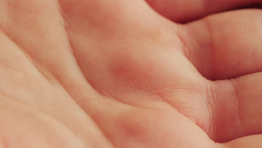 Close up footage texture of human skin, lines on the palm of the hand. High quality 4k footage