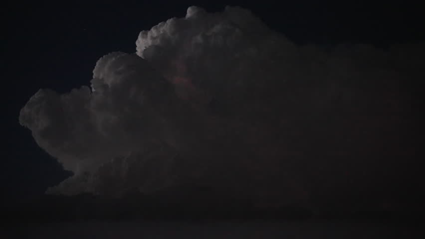 Brilliant bolts of lightning flash across a vivid dusk sky, casting light over storm clouds in motion. A breathtaking display of atmospheric energy, thunder, and cinematic weather drama