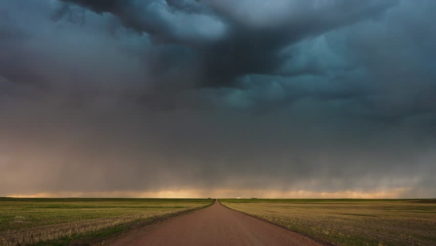 Jagged lightning forks streak across the horizon, illuminating storm clouds in a dramatic burst of energy. A breathtaking display of nature’s power, thunder, and atmospheric intensity