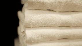 Soft clean folded towels stack. White towels in a laundry room, in bathroom, on a store shelf. - Powered by Shutterstock - Get 15% off with code: PIKWIZARD15