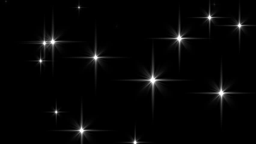 Sparkling, blinking stars. Glowing glitter particles create a magical, festive effect. Twinkle flare light background. Seamless loop. Embedded transparency