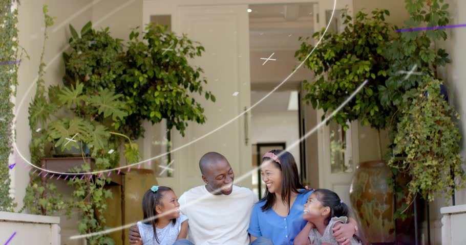 Dad placing arms around kids, streaks passing over family, smiling on stoop for marketing. Porch, steps, garden, plants, daylight, outdoors, cozy