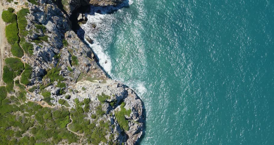 Topdown View Of Rocky Sea Cliffs At Sardinia, Italy. Aerial Shot