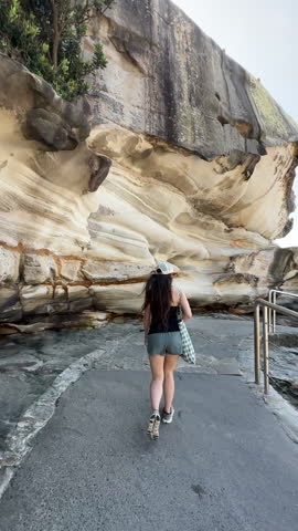 Vertical View of Woman Walking on Bondi to Bronte Coastal Walk, Scenic Pedestrian Route in Sydney, Australia