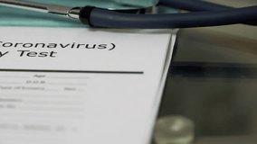 Covid-19 test kit on a clipboard with medical form, illustrating testing, healthcare, and pandemic safety procedures in detailed 4K footage. - Powered by Shutterstock - Get 15% off with code: PIKWIZARD15