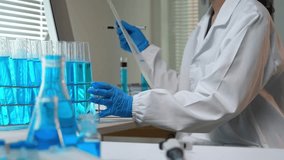 Professional scientist analyzing chemical compounds and recording experiment results on a computer - Powered by Shutterstock - Get 15% off with code: PIKWIZARD15