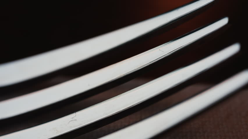 Close up of fork tines with soft reflections
