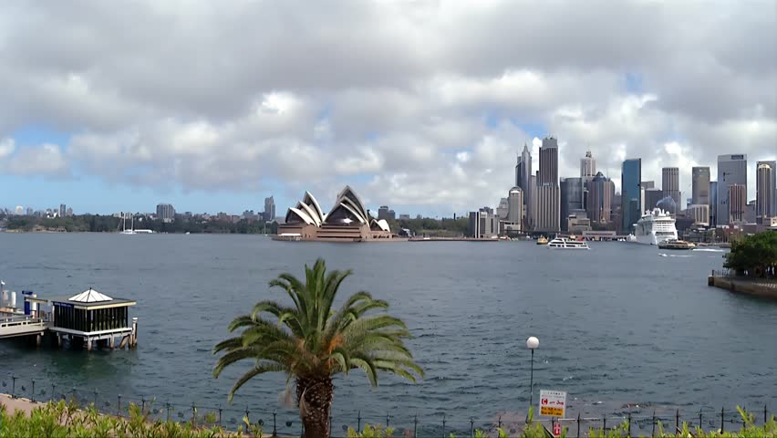 Sydney Harbour Bridge with the city and circular key in the background. Sydney ferry on the harbour