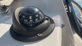 Lost On A Boat Out To Sea, The Captain Taps The Navigation Compass To See If It Is Working. Close Up Shot. - Powered by Shutterstock - Get 15% off with code: PIKWIZARD15