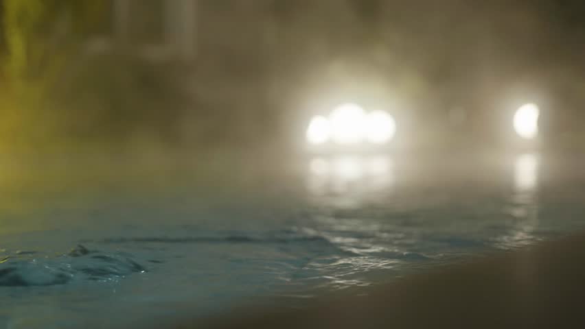 Steaming Hot Pool at Night with Flowing Water