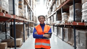 Portrait of a proud african american female worker with a barcode scanner standing in a large logistics warehouse, smiling confidently at the camera between shelves of cardboard boxes - Powered by Shutterstock - Get 15% off with code: PIKWIZARD15