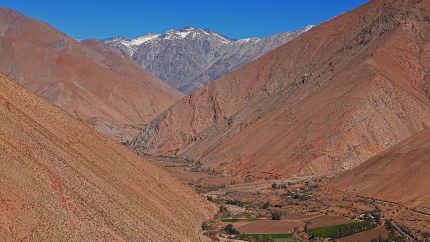 Panoramic aerial view of the mountains of the Elqui Valley in northern Chile during the dry winter season, on a sunny and clear day.