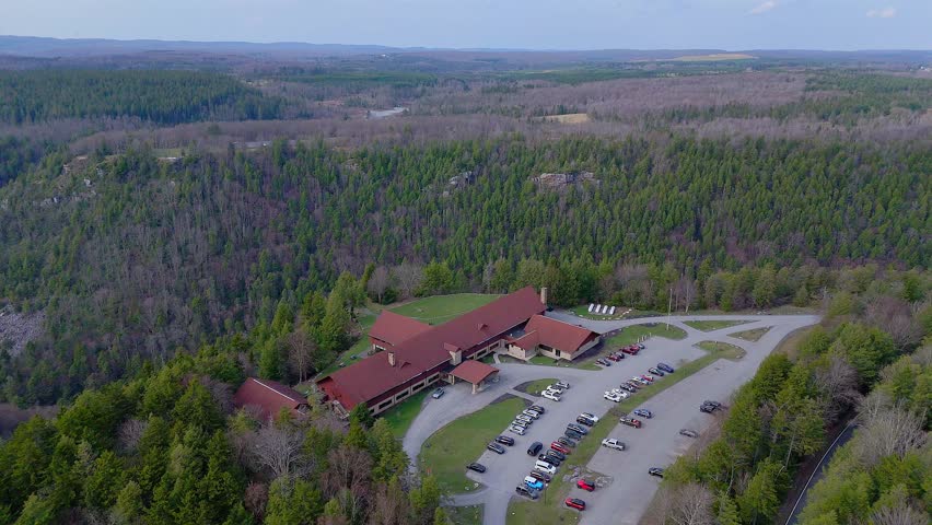 Lodge and parking lot in forest hills of Blackwater Falls State Park, West Virginia, USA