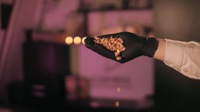 sugaring specialist pours sugar granules in black gloves on a pink background - Powered by Shutterstock - Get 15% off with code: PIKWIZARD15