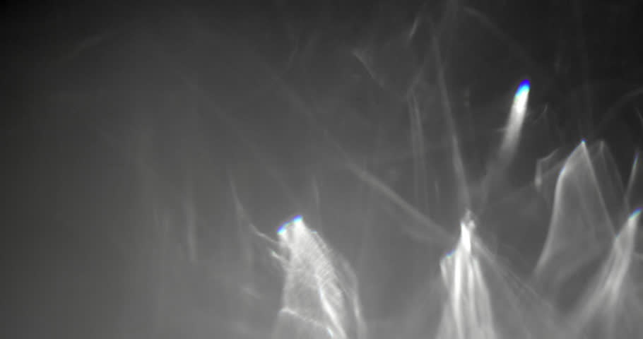 Glittering caustic FX on dark background. Abstract caustic reflections on black. Can be used as overlay elements for your projects, video texture or background for designs, scenes, etc. 