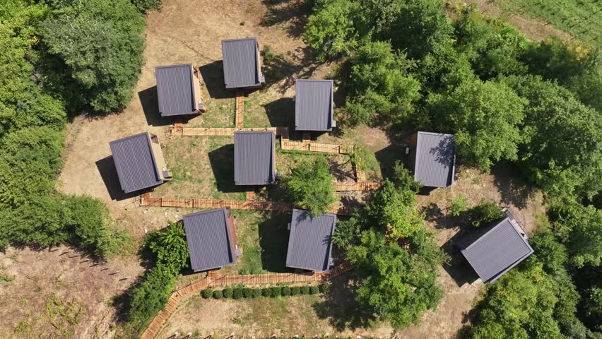 Discover modern cabins in a tranquil forest setting, showcasing architectural design. Perfect for vacation rentals, peaceful retreats, and nature tourism ventures.