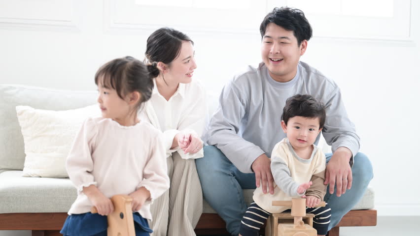 Daily Parenting Life of a Close-Knit Family Video of Caring for Children in the Living Room Watching Over Children's Growth	