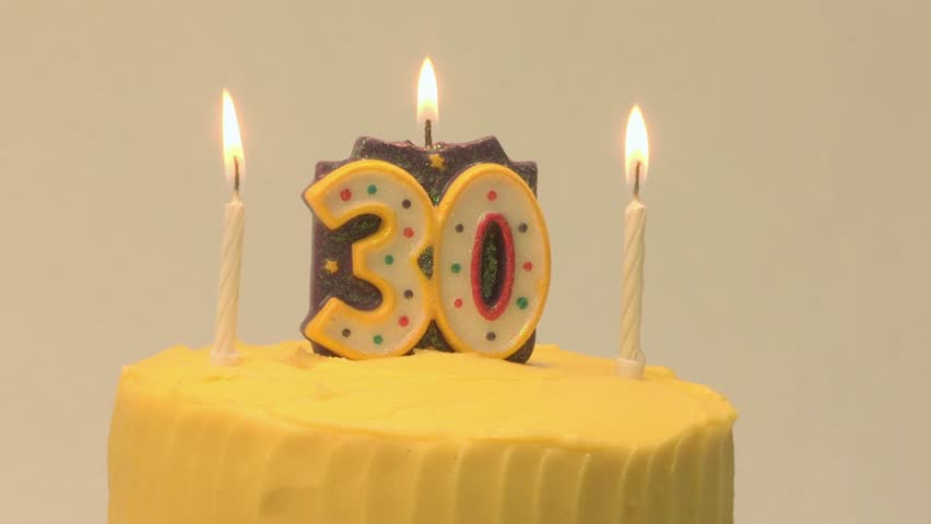 A vibrant 30th birthday cake decorated with three glowing candles. This symbolizes the celebrant's exciting new decade, full of potential, joy, and the bright promise of the future. - Powered by Shutterstock - Get 15% off with code: PIKWIZARD15