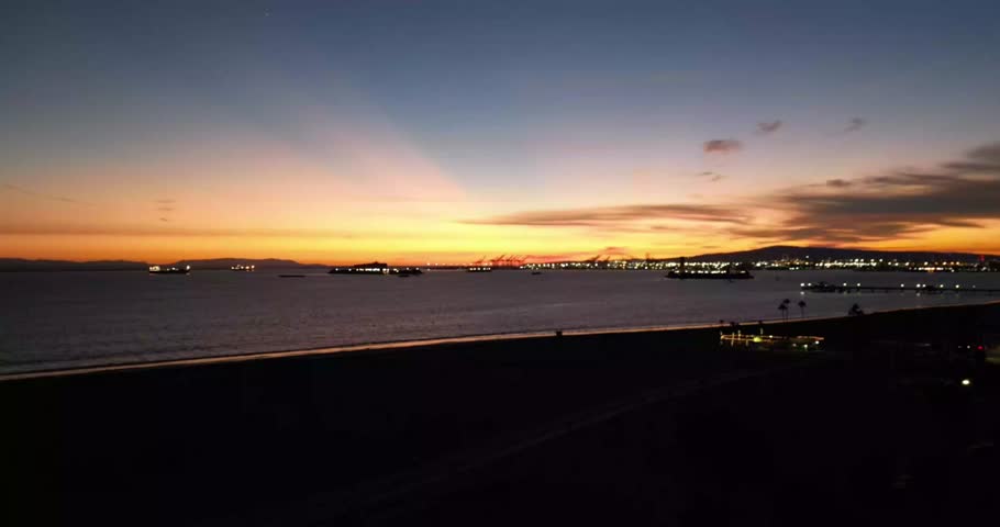 Aerial drone footage capturing the Long Beach skyline at sunset. Perfect for travel films, tourism videos, cinematic projects and documentaries highlighting urban California scenery and coastal living