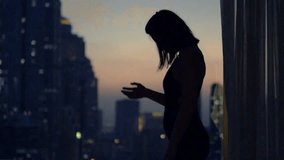 Super slow-motion of a sad, desperate woman walking by a window at home at night, capturing emotional struggle, solitude, and introspection. - Powered by Shutterstock - Get 15% off with code: PIKWIZARD15
