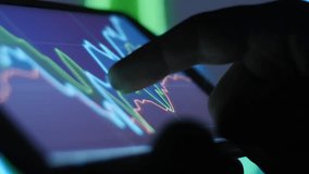 Closeup of a mobile smartphone displaying stock market trading, shares, and financial data, representing modern investing, fintech, and digital finance management. - Powered by Shutterstock - Get 15% off with code: PIKWIZARD15