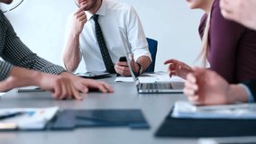 Casual business team holds a meeting in a bright modern office, highlighting teamwork, collaboration, and professional work environment. - Powered by Shutterstock - Get 15% off with code: PIKWIZARD15