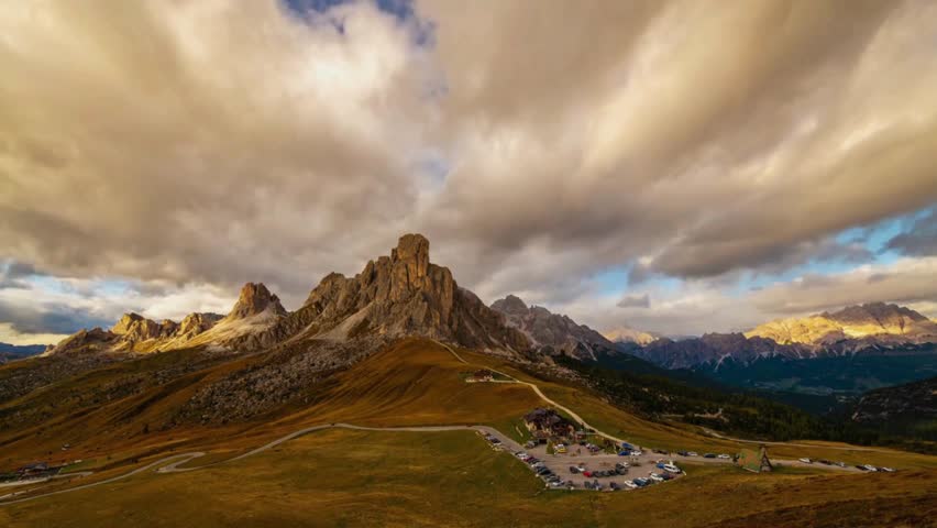 Majestic Mountain Range with Dramatic Clouds and Valley Below