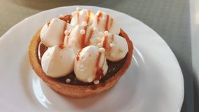 Caramel Tartlet With Meringue And Chocolate Filling. Mini Tart Dessert Decorated With Crispy Pearls. - Powered by Shutterstock - Get 15% off with code: PIKWIZARD15