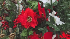 Festive holiday background with red and white poinsettias, pine cones, and frosted berries - Powered by Shutterstock - Get 15% off with code: PIKWIZARD15