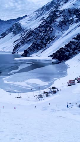 Vastness Santiago Chile. Ski station center at snowing Andes Mountains near Santiago Chile. Vastness Snow mountain landscape at winterness. Winter ness travel destination. Winter ness tourism travel.