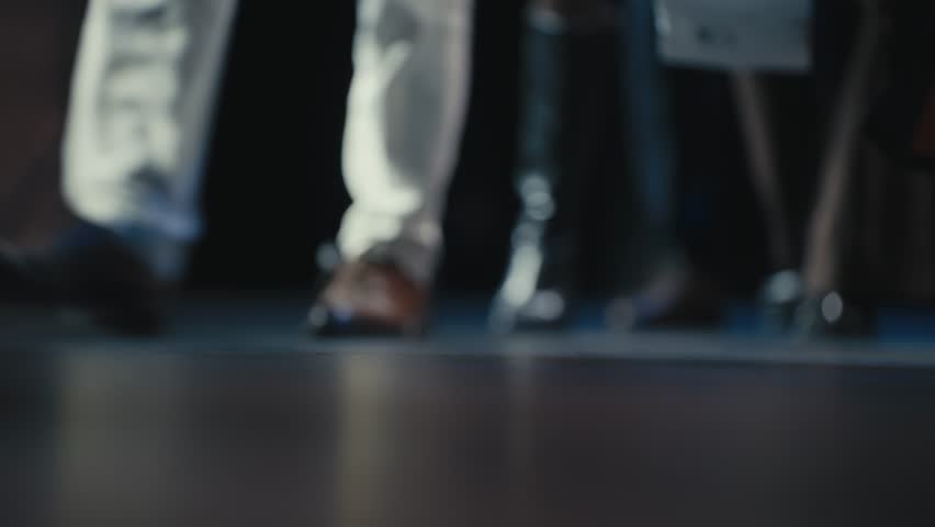 Close-Up of Graduates Walking on Stage in Formal Footwear