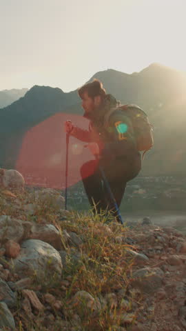 epic sunrise hike slow motion man with trekking poles cinematic mountain footage