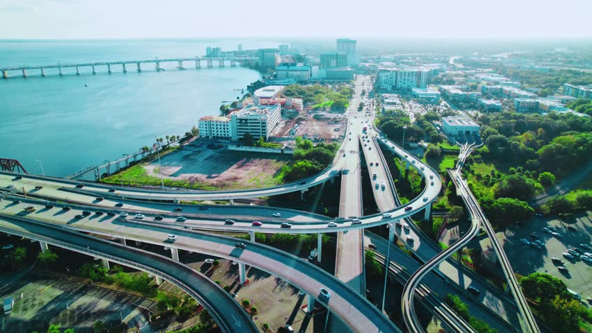 Aerial view of vehicle traffic in Jacksonville, Florida, showing busy highways, urban roads, and city infrastructure. Perfect for transportation, city planning, and urban lifestyle visuals.