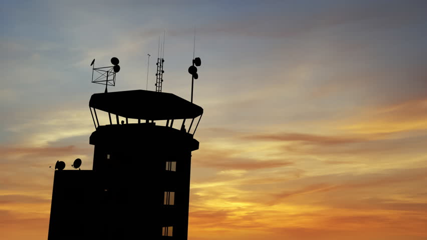 Air Traffic Control Tower at Airport As Airplane Takes Off.